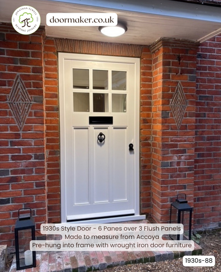 1930s style door painted white with black ironmongery